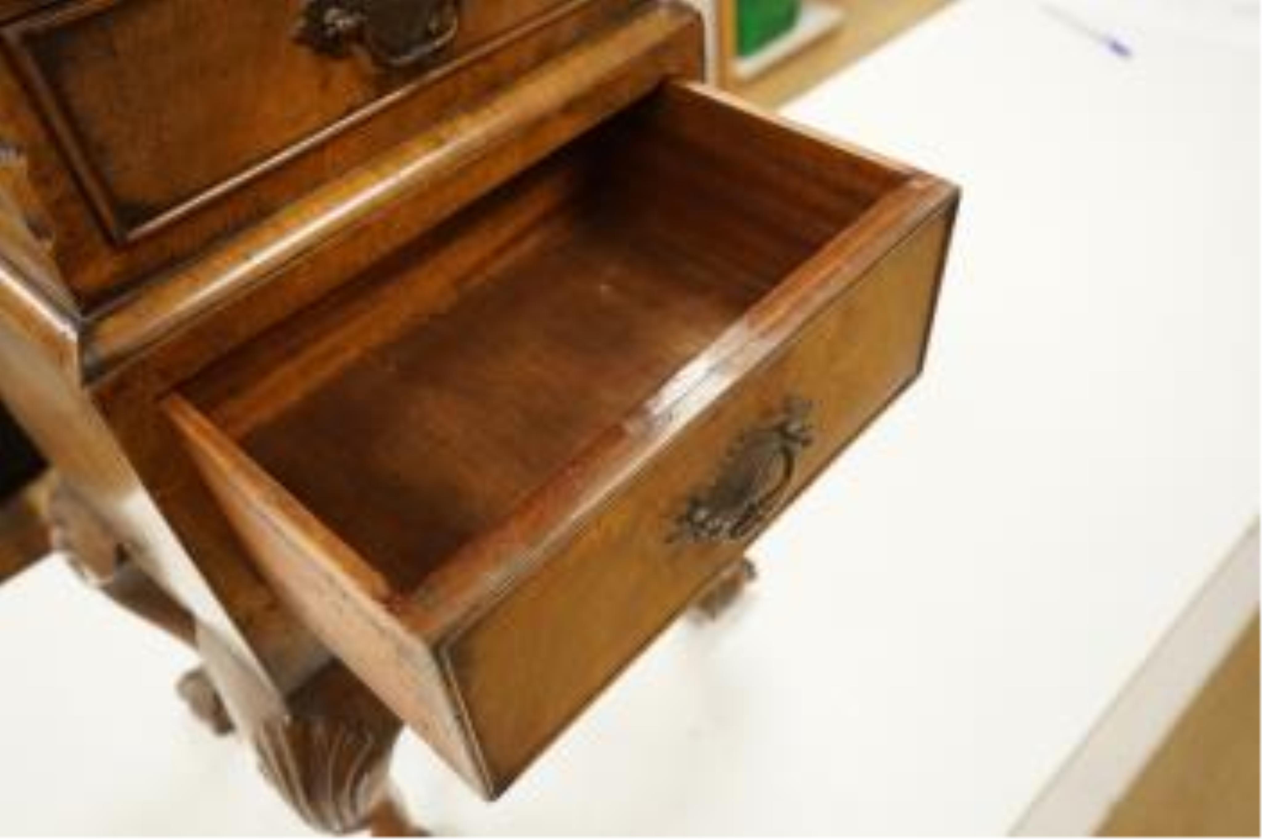 An early 20th century miniature walnut four drawer chest, 67cm